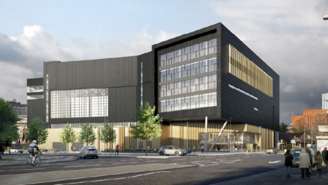 A CGI image of a black and gold angular building next to a road. The building is black in colour with several large window sections.