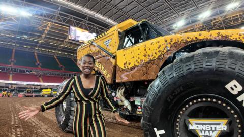 Shanequa-in-front-of-a-monster-truck.