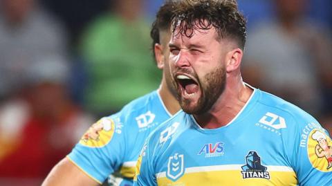Josh Stimson celebrates a try for Gold Coast Titans