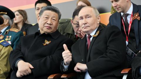 President of Russia Vladimir Putin (R) and President of China Xi Jinping (L) attending the Victory Day military parade