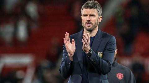 Michael Carrick applauds fans at Old Trafford