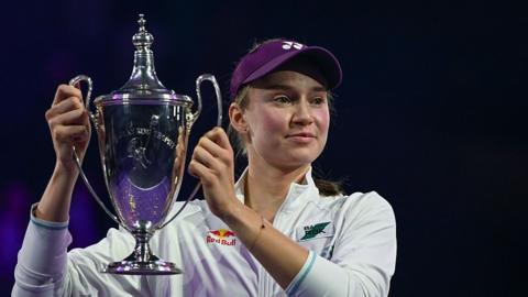 Elena Rybakina holds the WTA Finals trophy