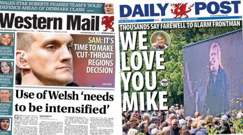 Daily Post front page. Main image Mike Peters, Text: Thousands say farewell to Alarm frontman. We love you Mike. Western Mail front page. Man's face, text: Sam: It's time to make 'cut-throat' regions decision. Story beneath a grey line, text: Use of Welsh 'needs to be intensified'. Stories down the left side: Mike Peters, he is smiling and has long blond hair. Text: Farewell to alarm frontman. Blue box beneath, photo of woman smiling, she has brown hair. Text: Urdd chair winner unveiled. Next blue box beneath has a photo of a man smiling. Text: Liverpool suspect named. Blue box beneath has a photo of a man with a scrum hat on. Text: Jenkins ruled out of tour. 