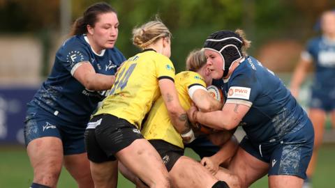 Sale Sharks and Trailfinders players battle for the ball