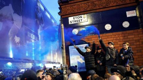 Everton fans greet their team before the final Merseyside derby against Liverpool at Goodison Park