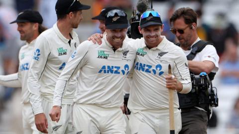 New Zealand's Henry Nicholls (left) and captain Tom Latham (right) celebrate Test series victory over England