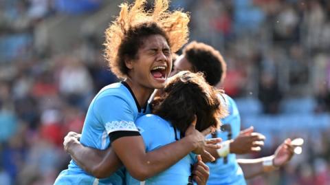 Fiji celebrate beating Wales at the Women's World Cup