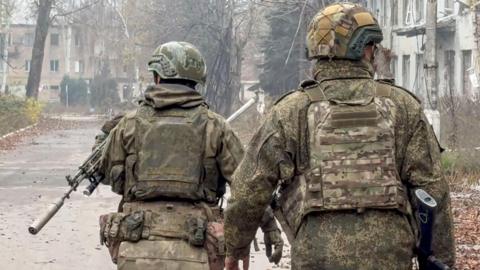 An image shared by the Russian Defence Ministry press-service which claims to show two Russian servicemen in military garb checking streets of Krasnoarmeysk (Pokrovsk) in the Donetsk region in Ukraine. 