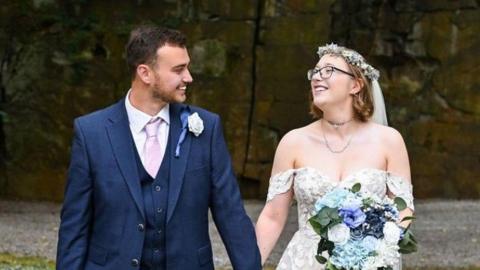Georgia Finch and her husband on their wedding day 