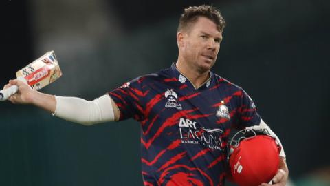 David Warner raises his bat in the PSL