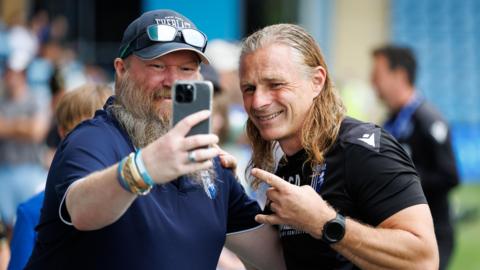 Gareth Ainsworth with a Gillingham fan