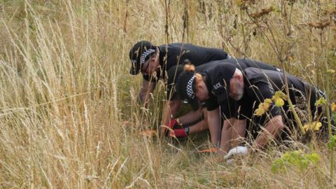 Investigators in Brantham conducting fingertip searches in an area