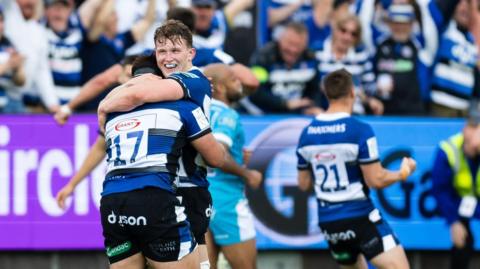 Bath players hug in celebration after beating Sale in the semi-final 