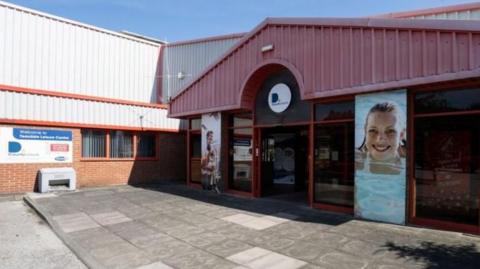 The outside of a closed leisure centre.