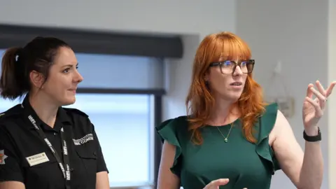 Housing Secretary Angela Rayner (right) speaking to emergency responders who fought the home-destroying Stourbridge fires 