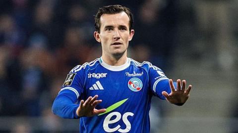 Ben Chilwell gesturing with both hands open to receive the ball while playing for Strasbourg