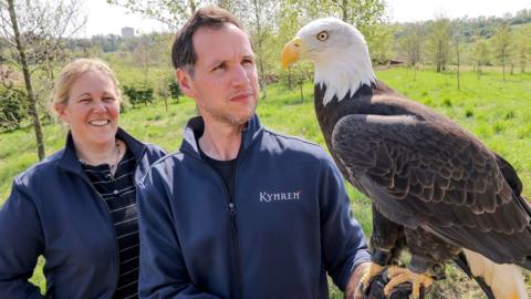 Kynren's CEO Anna Warnecke and bird curator Jimmy Robinson with a bald eagle