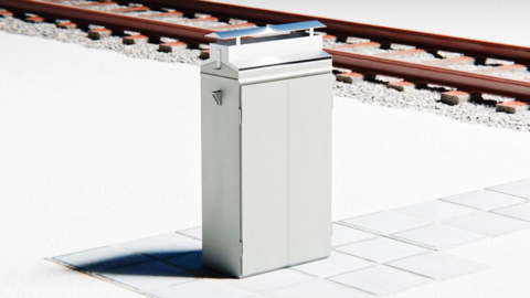 A computer-generated image of a signalling cabinet by the side of train tracks.