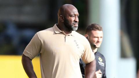 Port Vale manager Darren Moore on the touchline