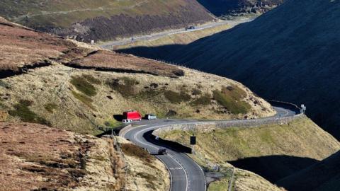 Windy road surrounded by countryside