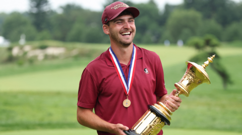 Jack Whaley holding the US Amateur golf trophy