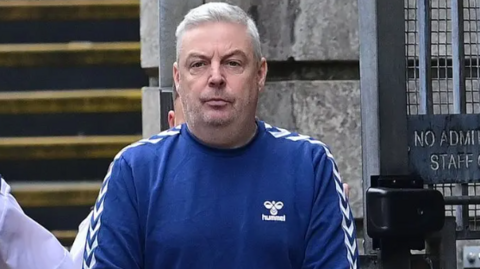 Christopher Paul O'Kane pictured in a blue sweatshirt
