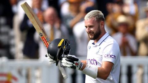 England's Gus Atkinson celebrates hitting a century