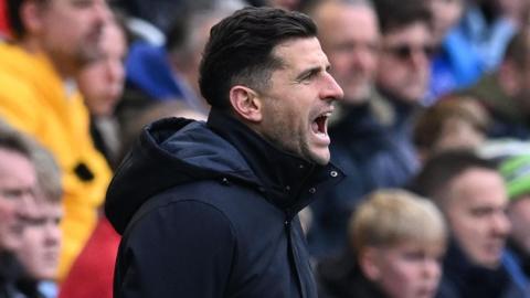 John Mousinho shouting