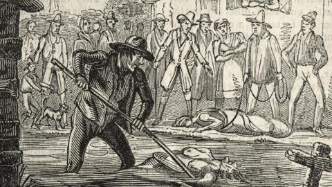 A black-and-white image of a sketch showing a group of individuals dressed in historical clothing from the 18th century, gathered near a body of water. One person in the foreground, Thomas Colley, is using a long pole to push Ruth Osborne into the water. The individual wears a wide-brimmed hat and period attire. In the background, several people observe the scene, some gesturing or reacting. A building is visible behind them, and another body, wrapped in cloth, lies on the ground nearby.