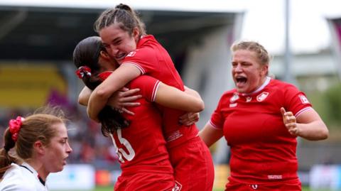 Canada celebrate Taylor Perry's try against Wales