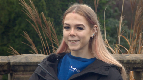 A girl pictured, smiling