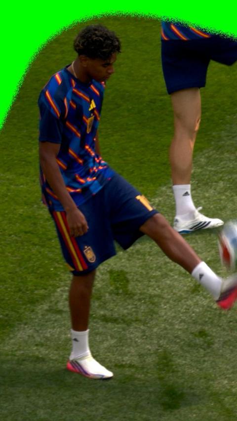 Lamine Yamal doing keepy-uppies on the pitch before Spain faces Belgium in the 2026 World Cup.