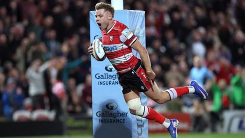Charlie Atkinson, of Gloucester, dives over the line to score the winning try against Sale Sharks