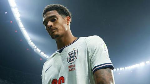 Jarell Quansah walks off the pitch after being sent off during the World Cup 2026 match between Mexico and England