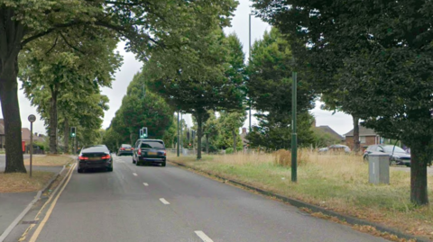 A streetview of a main city road with two carriageways