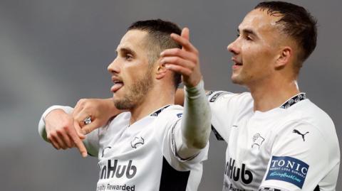 Jerry Yates (left) celebrates scoring for Derby County West Brom in the first half