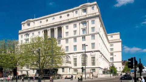 The Britannia Adelphi Hotel in Liverpool, photographed on a beautiful sunny day with blue skies. The large white building has been part of city's skyline for decades.