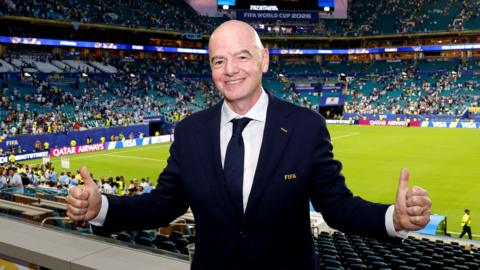 Gianni Infantino puts two thumbs up in front of the pitch where Uruguay play Cabo Verde at the 2026 World Cup