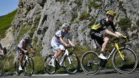 Tadej Pogacar and Jonas Vingegaard climbing during stage 12 of the 2025 Tour de France