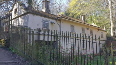 The Victorian-era Birley Spa, with both its building and surrounding grounds in a state of disrepair and decay.