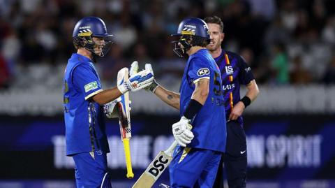 Ollie Pope and Tom Curran celebrate hitting the winning runs for MI London v London Spirit