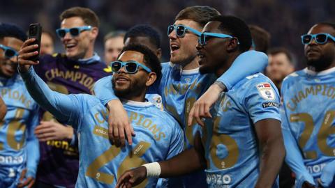 Coventry City players celebrating by taking a selfie