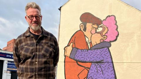 Pete McKee with his repainted mural