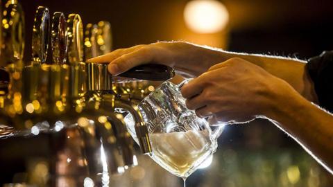 Beer being poured out in a pub in the Czech Republic.