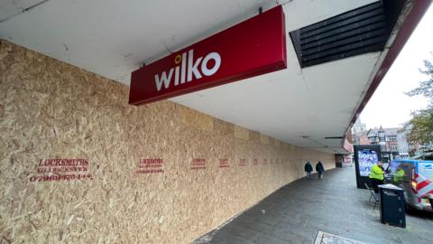 The front of the Wilko store in Gloucester which is boarded up, and still had the sign outside