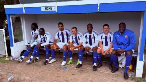 An image showing three former Premier League footballers playing for an amateur Sunday league side  - Oumar Niasse, Papiss Cisse, Marcel Edwards, Blake Norton, Manor Figueroa, Dean Warburton, Emile Heskey