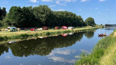 Emergency services at the side of a riverbank