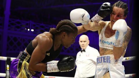 Caroline Dubois punches a bloodied Terri Harper