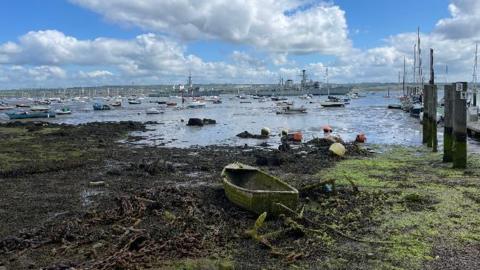 An array of vessels in Gosport under a blue sky