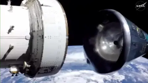 Crew module separating from spacecraft with Earth in the background